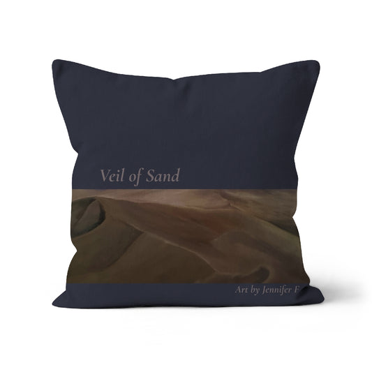 Veil of Sand art cushion by Jennifer F, featuring warm brown desert dunes across the lower section of a deep blue-grey faux suede cushion.