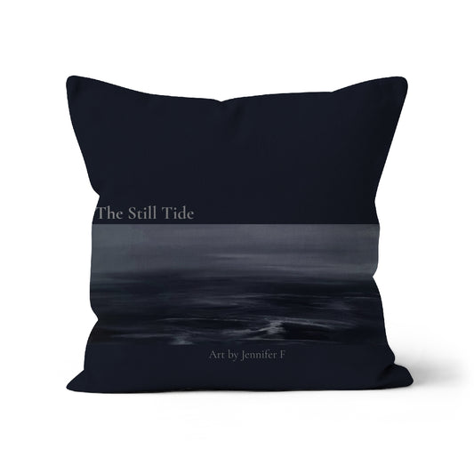 The Still Tide art cushion by Jennifer F, featuring a deep navy background with a horizontal section of misty seascape artwork in grey-blue tones.
