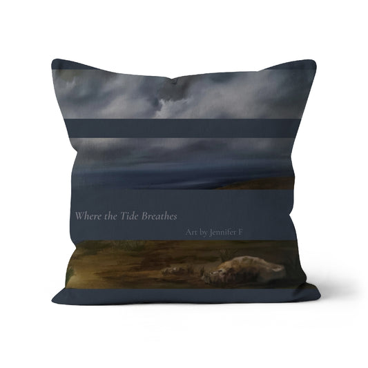 Where the Tide Breathes art cushion by Jennifer F, featuring layered coastal artwork in deep blues, grey clouds and warm shoreline tones.